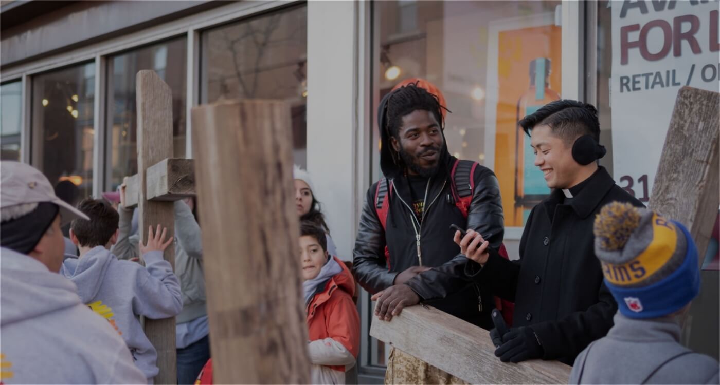 priest helping the community